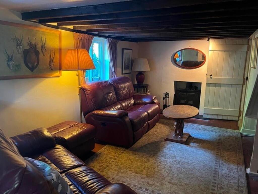 Lot: 113 - DETACHED COTTAGE FOR IMPROVEMENT ON 0.3 ACRE PLOT - Living room